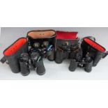 Four cased pairs of binoculars comprising Swift, Chinon and Prinz 10x50 and an unnamed 8x40 pair