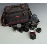 Canon T70 SLR camera with 50mm 1:1.8 and 35-70mm 1:3.5-4.5 lenses, Sigma 70-210 f 4.5 lens, three