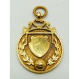 A 9ct gold military football medal with ball in relief to front, engraved verso USL Chatham 1922-3