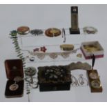 A collection of jewellery including brooches, silver Taxco Mexican pendant, Potens desk stand, white