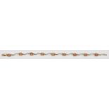 A 9ct gold bracelet set with topaz and diamonds, 3.7g