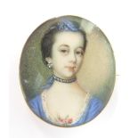 An early Victorian brooch set with a portrait miniature of a lady, 3.3 x 2.8cm