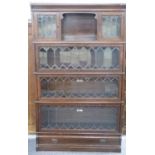 Four tier Globe Wernicke oak bookcase with leaded glass fronts, the top section with central cubby
