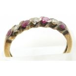 A 9ct gold ring set with rubies and alternating cubic zirconia, 1.9g, size O