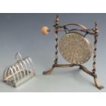 Elkington silver plated seven bar toast rack together with a plated Burmese dinner gong, diameter
