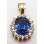 A 9ct gold pendant set with an oval cut kyanite surrounded by diamonds