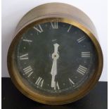 Gibson brass bulkhead military clock with black Roman dial, 20cm diameter
