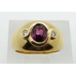 COLLECTING  A 14ct gold ring set with an oval cut ruby measuring approximately 1.1ct and two further
