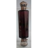 A white metal topped double ended faceted amethyst glass scent bottle with embossed decoration to