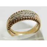 A 9ct gold ring set with three rows of diamonds, 5.0g, size L