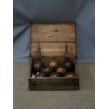 Eight vintage wooden bowls and two jacks in wooden box