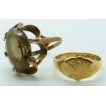 An 18ct gold signet ring, Birmingham 1914, 4.9g, and a 9ct gold ring set with paste, 9.25g.
