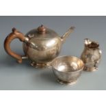 George V Irish hallmarked silver three piece bachelor's teaset, the teapot of bullet shape, Dublin