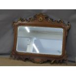 Regency or similar mirror with gilt scrolling details and bevelled glass, 95 x 80cm overall