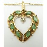 A 9ct gold heart pendant set with marquise cut emeralds and a diamond, in original Brooks &