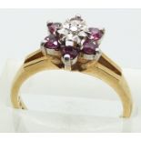 COLLECTING  A 9ct gold ring set with diamond and pink sapphires, 3.2g, size N