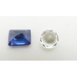 A loose round cut white sapphire and a rectangular step cut synthetic sapphire measuring 4.1ct