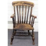 A 19thC elm seated Windsor chair, 92cm high