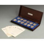 'The Royal Arms', cased set of 12 hallmarked silver shield shaped Coats of Arms, weight 581g