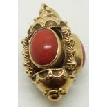 An 18ct gold pendant set with three coral cabochons, 6.7g