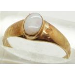 A 9ct gold ring set with an opal cabochon, 1.6g, size N
