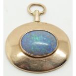 A yellow metal pendant set with an oval opal cabochon, 3.3 x 3.9cm