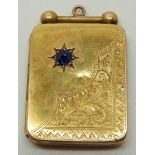 Art Deco 15ct gold rectangular locket set with a sapphire in a star setting and with engraved