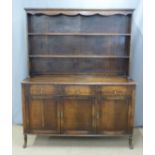 Oak dresser with plate rack above and three drawers with cupboards to base, W153 x D50  x H189cm