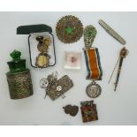 A collection of bijouterie items including brooches, a hallmarked silver mounted glass container,
