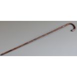 A bamboo walking stick with silver mounts