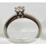 Tiffany and Co platinum ring set with a round brilliant cut diamond measuring approximately 0.