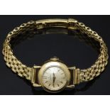 COLLECTING Omega 18ct gold ladies wristwatch ref. 10774 with gold hands and hour markers,