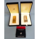 Two cased Dunhill Rollagas lighters, one chrome plated the other gold plated