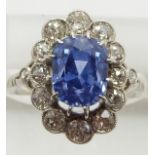 A platinum ring set with a mixed cushion cut natural untreated cornflower blue Sri Lankan sapphire