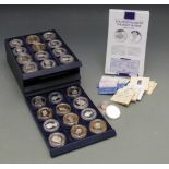 Twenty six silver crown sized Royal commemorative coins in a collector's tray, some with