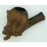 A 19thC/20thC  Black Forest carved pipe in the form of a bear smoking a pipe, approximately 8cm in