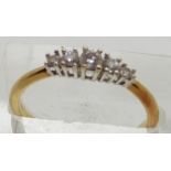An 18ct gold ring set with five diamonds, 2.6g, size O