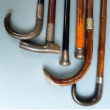 Six hallmarked silver mounted and similar walking sticks and canes, most circa late Victorian and