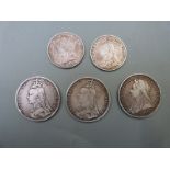 Five Victorian silver coins including three crowns (1890, 1892 and 1893) and two half crowns (1887