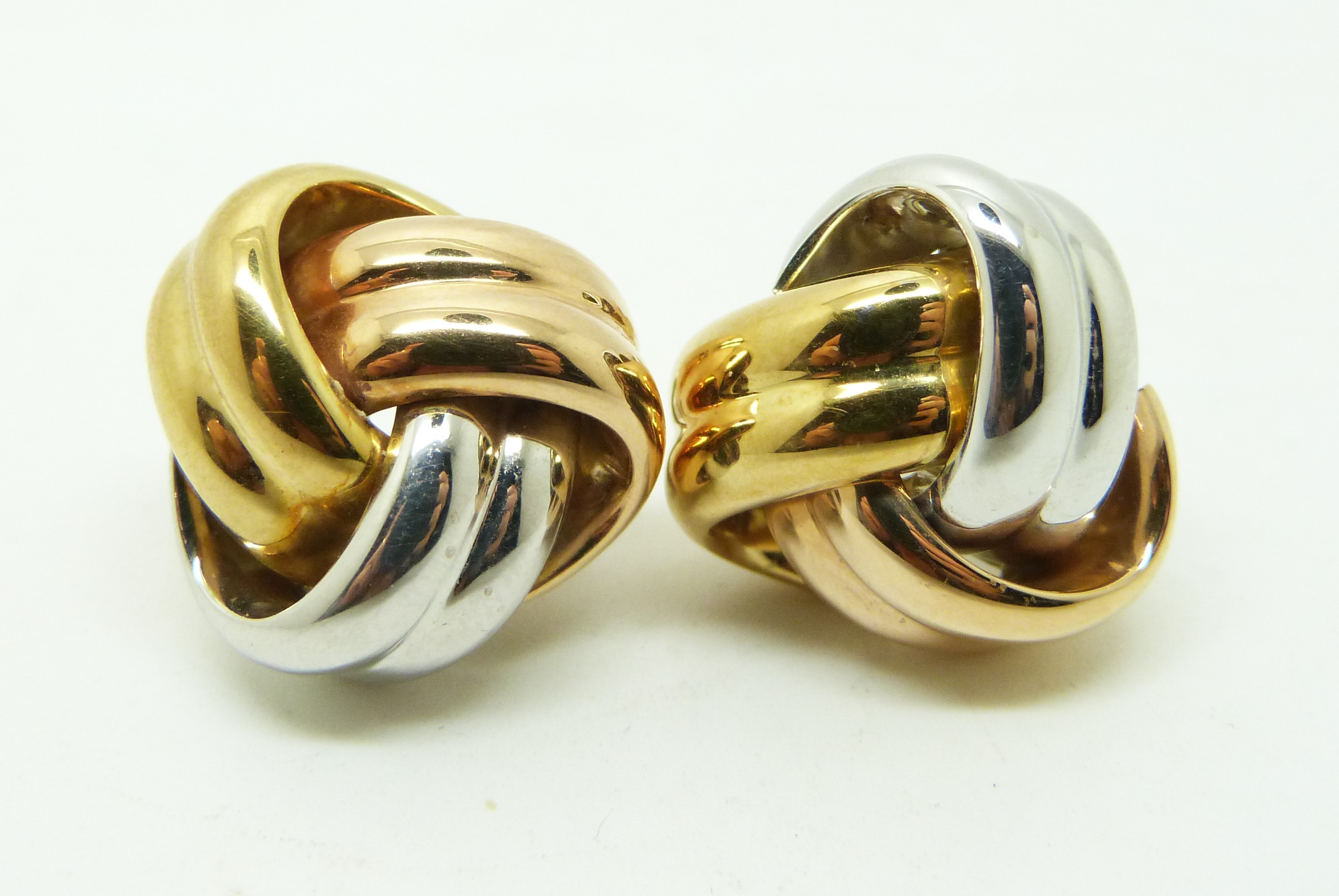 A pair of 18k gold bi-coloured knot earrings