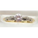 An 18ct gold ring set with a diamond of approximately 0.35ct in a platinum setting, 1.9g, size J