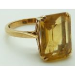 A 9ct gold ring set with an emerald cut citrine, 3.9g, size K