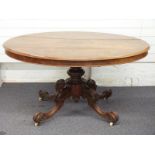 Victorian walnut and figured walnut oval breakfast table, the tilting top with quartered figured