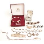 A collection of silver jewellery including rings, marcasite necklace, snake bangle etc