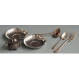 Two coin based pin dishes marked silver, three pieces of hallmarked silver cutlery and a