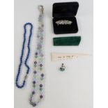 Single strand of lapis lazuli beads, a strand of agate beads and a bone and malachite paper knife