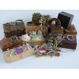 A collection of wooden jewellery boxes and costume jewellery including beads, bracelets etc