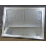 A large rectangular mirror with silver frame, 91 x 122cm overall