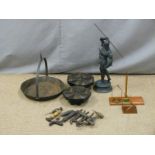 Two cast iron component holders, hanging frying pan, cobblers tools, set of post office scales and a
