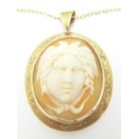 A Victorian yellow metal pendant set with a cameo on a 9ct gold chain (Chain- 7g)